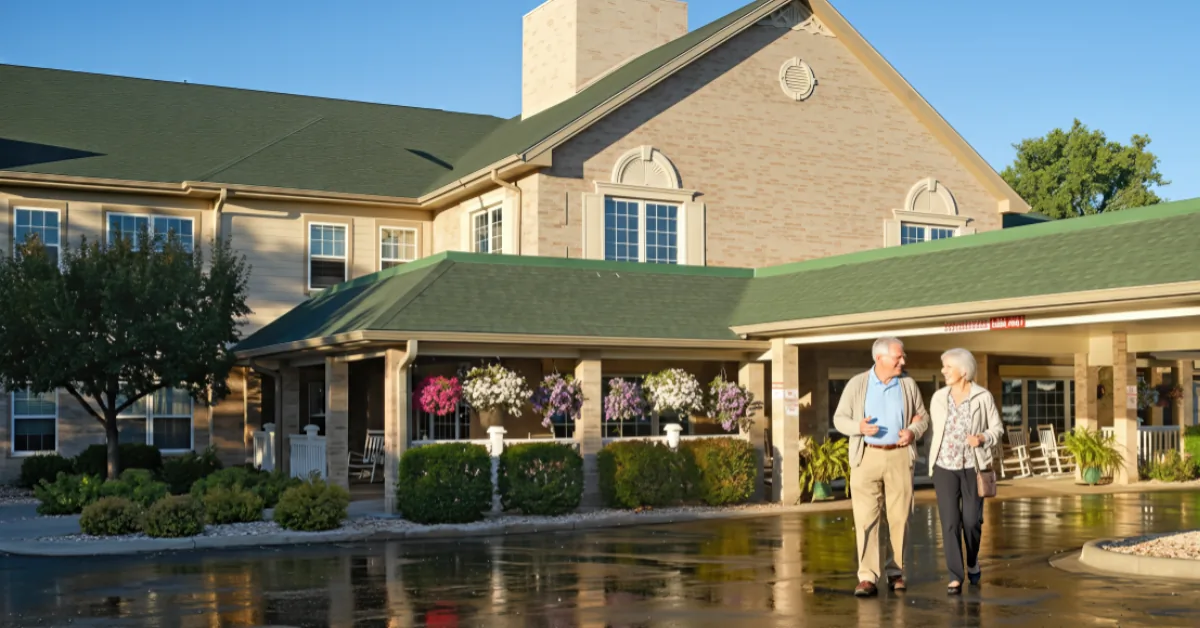 Gardens at Columbine residents walking outside the main community entrance.